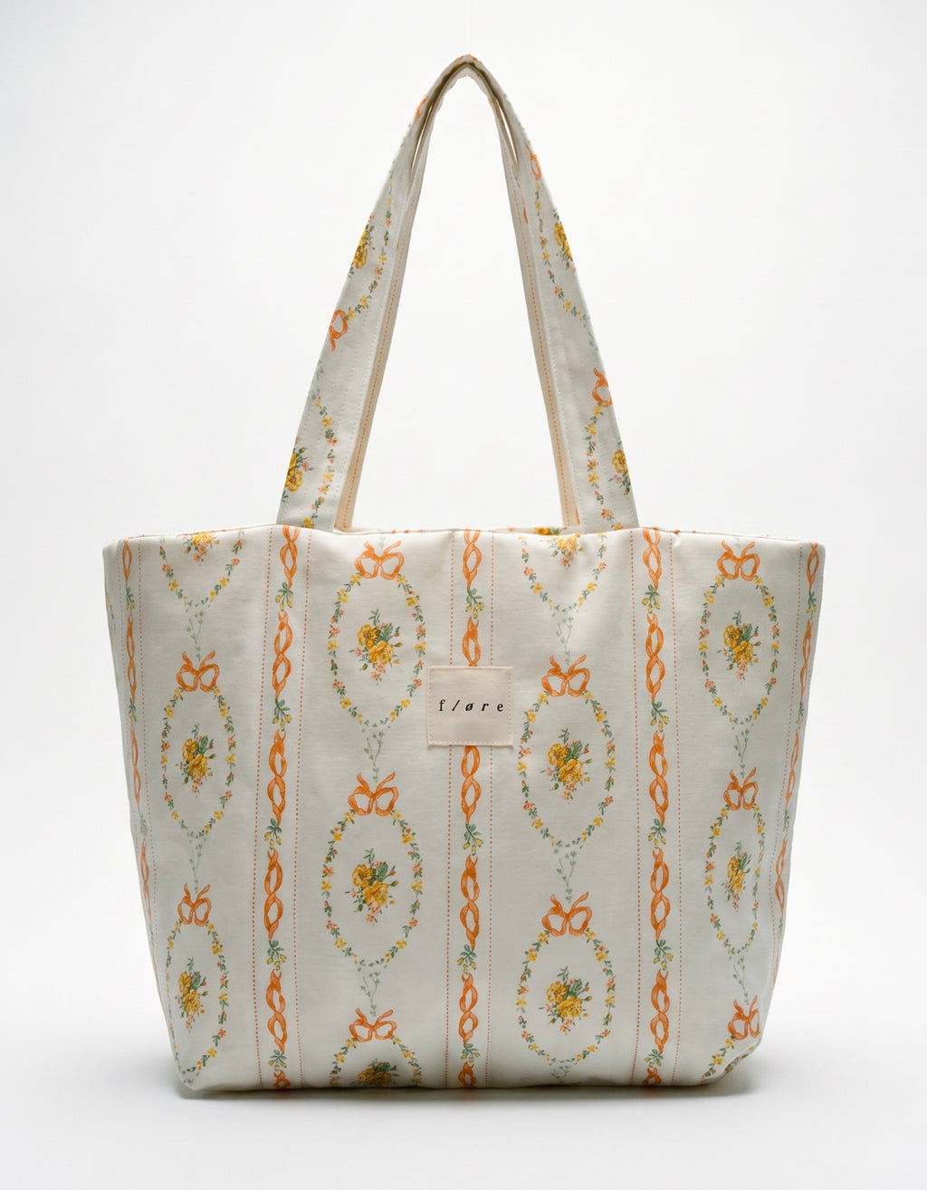 Patterned tote bag with floral design on a white background