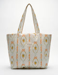 Patterned tote bag with floral design on a white background