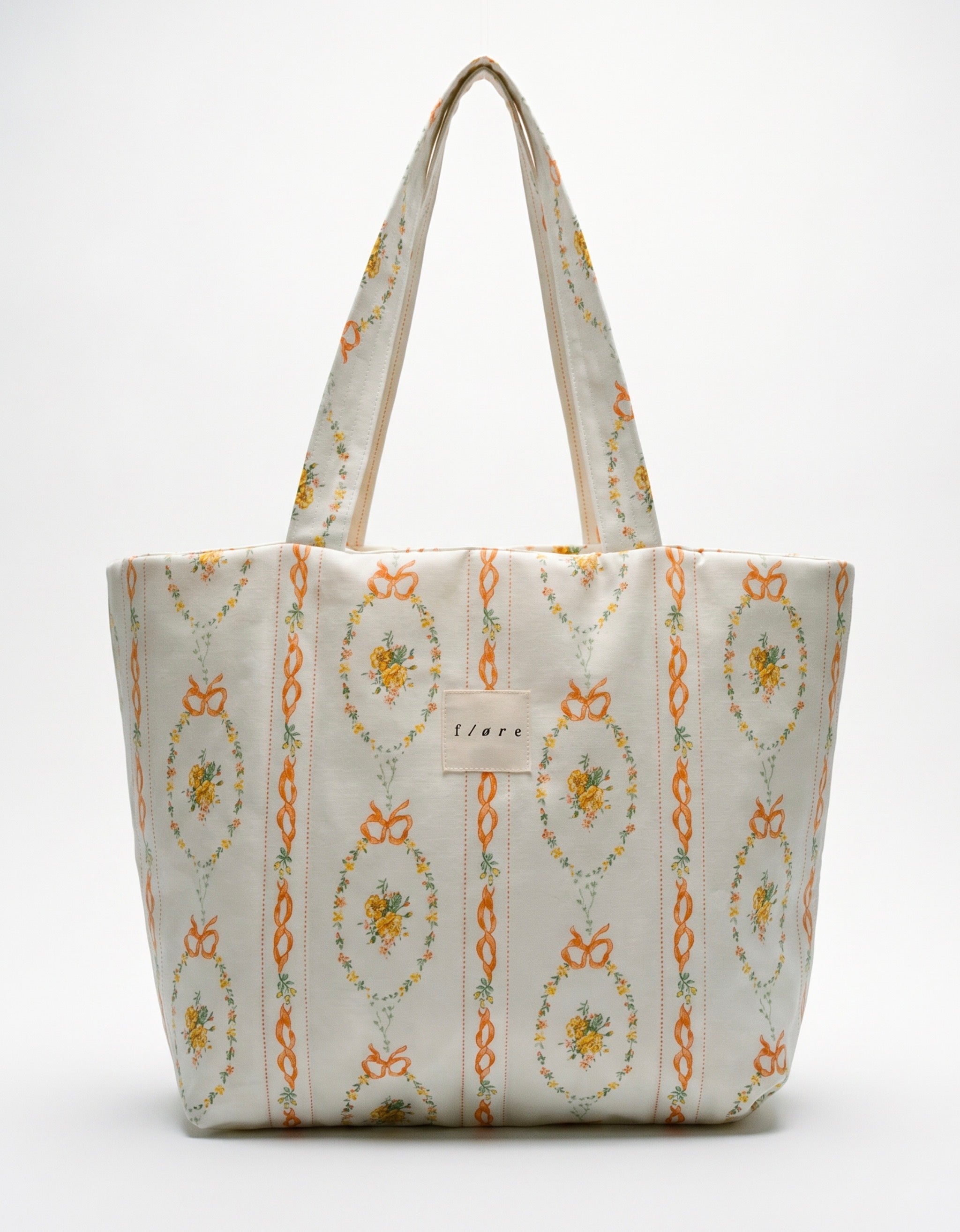 Patterned tote bag with floral design on a white background